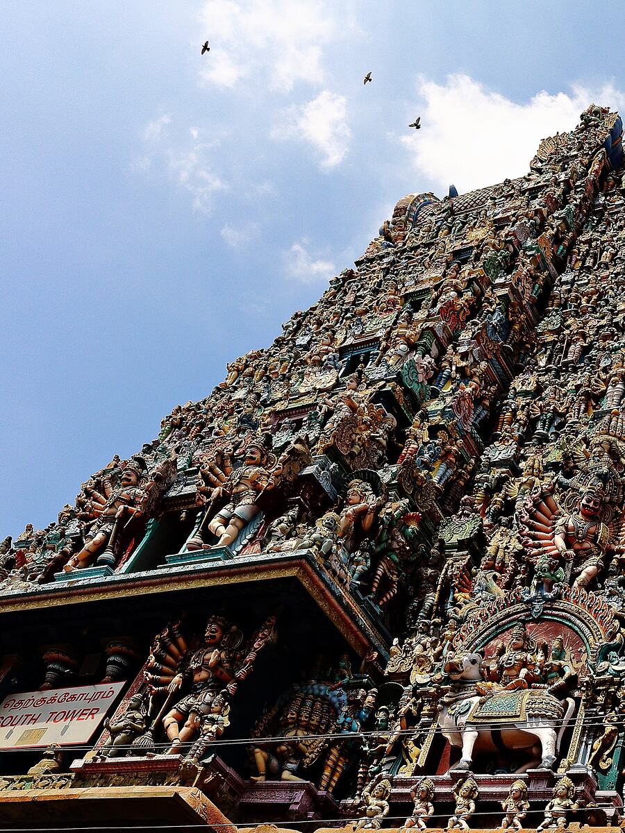 Carved figures covering a gopuram at Madurai